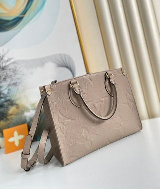 Pre-Loved LOUIS VUITTON Empreinte Monogram Giant Onthego PM Tourterelle Creme - SMY Digital