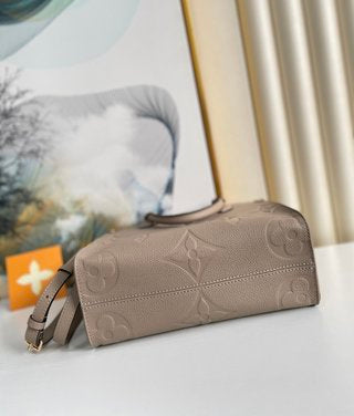 Pre-Loved LOUIS VUITTON Empreinte Monogram Giant Onthego PM Tourterelle Creme - SMY Digital
