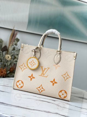 Pre-Loved LOUIS VUITTON Empreinte Monogram Giant Wild At Heart Onthego MM - SMY Digital