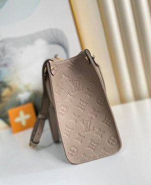Pre-Loved LOUIS VUITTON Empreinte Monogram Giant Onthego PM Tourterelle Creme - SMY Digital
