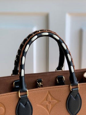 Pre-Loved LOUIS VUITTON Empreinte Monogram Giant Wild At Heart Onthego MM - SMY Digital