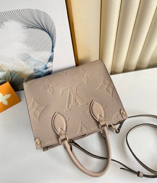 Pre-Loved LOUIS VUITTON Empreinte Monogram Giant Onthego PM Tourterelle Creme - SMY Digital