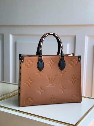 Pre-Loved LOUIS VUITTON Empreinte Monogram Giant Wild At Heart Onthego MM - SMY Digital